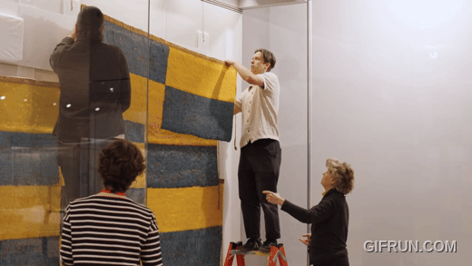 Still from Installing the Wari Feather Panel at The Met